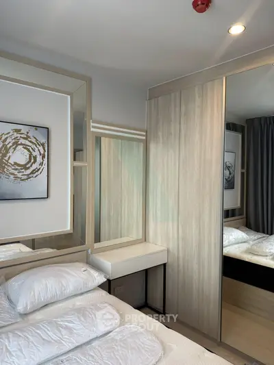 Modern bedroom with stylish wooden wardrobe and elegant decor