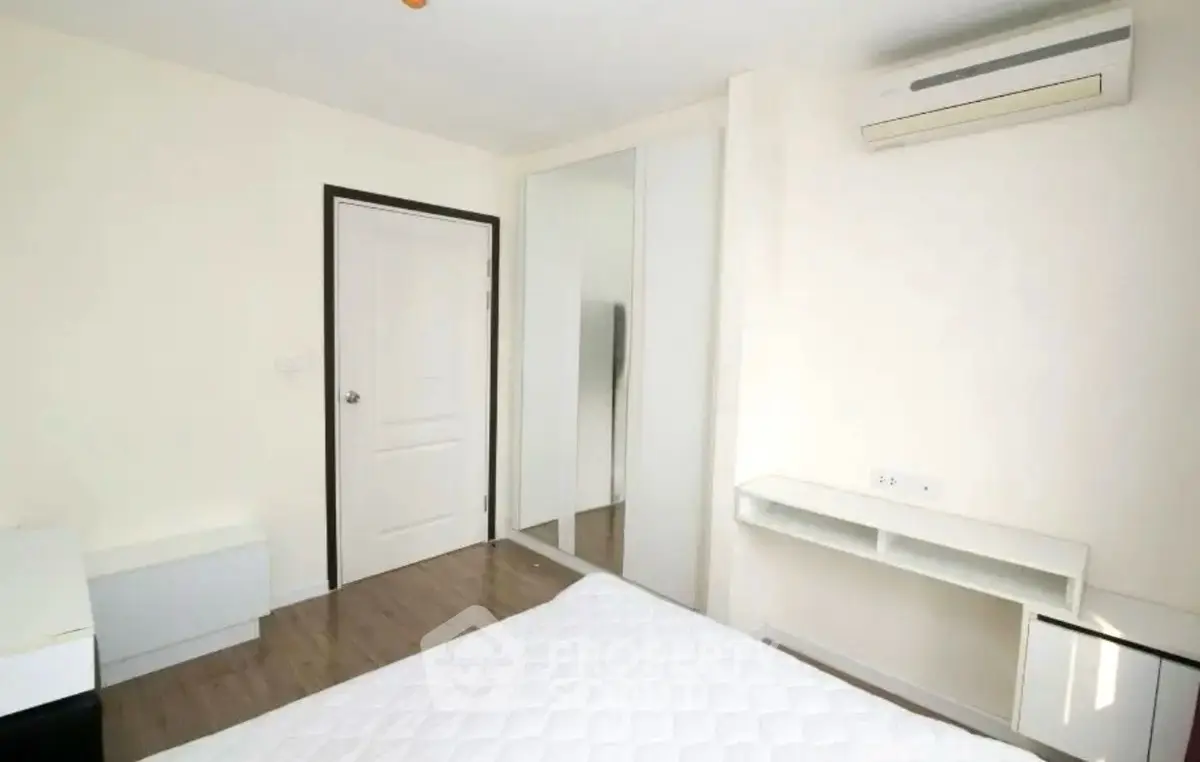 Modern minimalist bedroom with air conditioning and mirrored closet