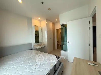 Modern bedroom with ensuite bathroom in a bright apartment