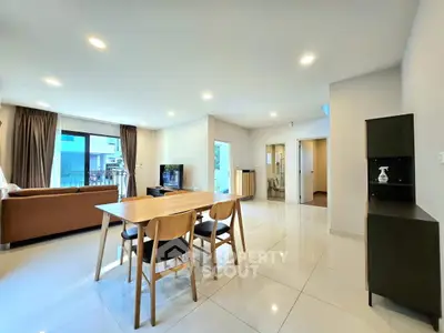Spacious modern living room with open layout and elegant dining area
