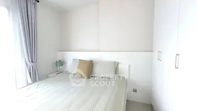 Bright and cozy bedroom with modern decor and ample natural light