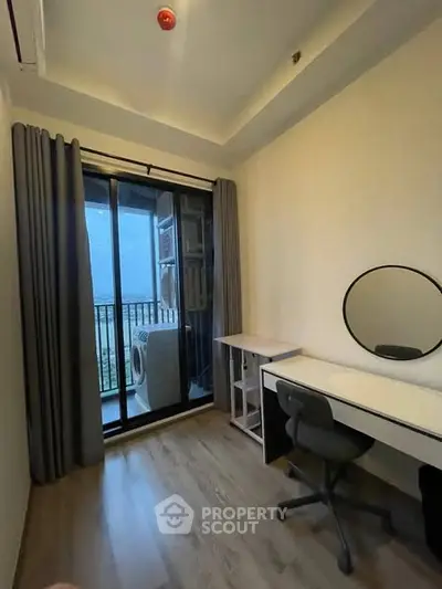 Modern study room with balcony view and sleek furniture