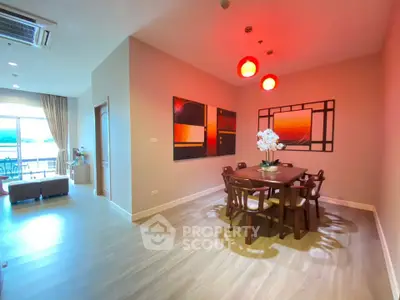 Spacious dining area with modern decor and natural light in a stylish apartment.
