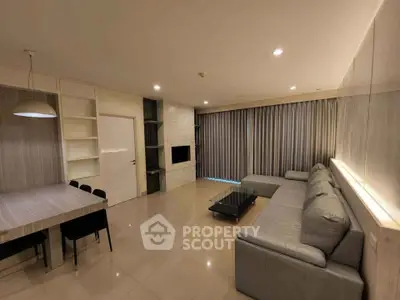 Spacious modern living room with sleek furniture and ambient lighting