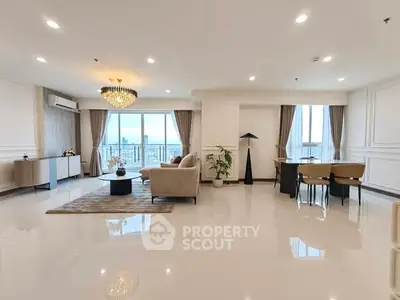 Spacious modern living room with elegant decor and city view, perfect for luxury urban living.