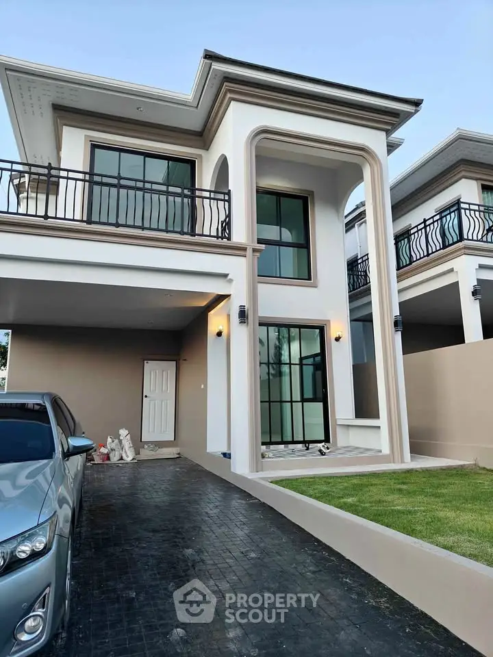 Modern two-story house with sleek design and spacious driveway