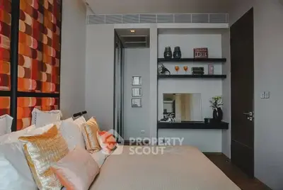 Luxurious bedroom with modern decor and stylish shelving in a high-end apartment.