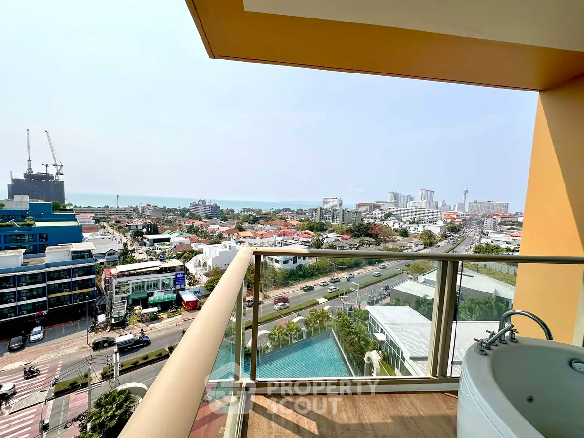 Stunning city and ocean view from a high-rise balcony with jacuzzi