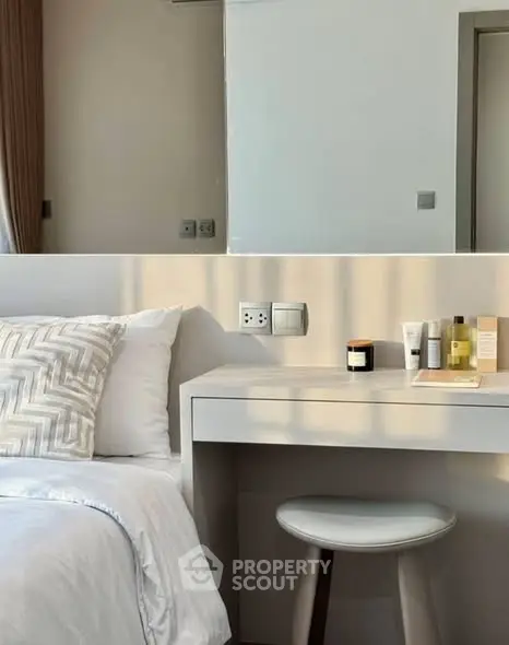Modern bedroom with stylish vanity and cozy bedding