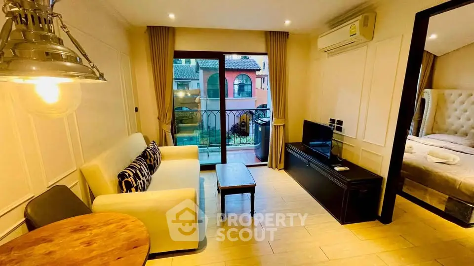 Charming living room with cozy sofa, modern lighting, and balcony view in stylish apartment.