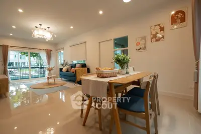 Spacious modern living room with dining area and large windows