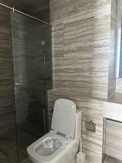 Modern bathroom with sleek design and glass shower enclosure