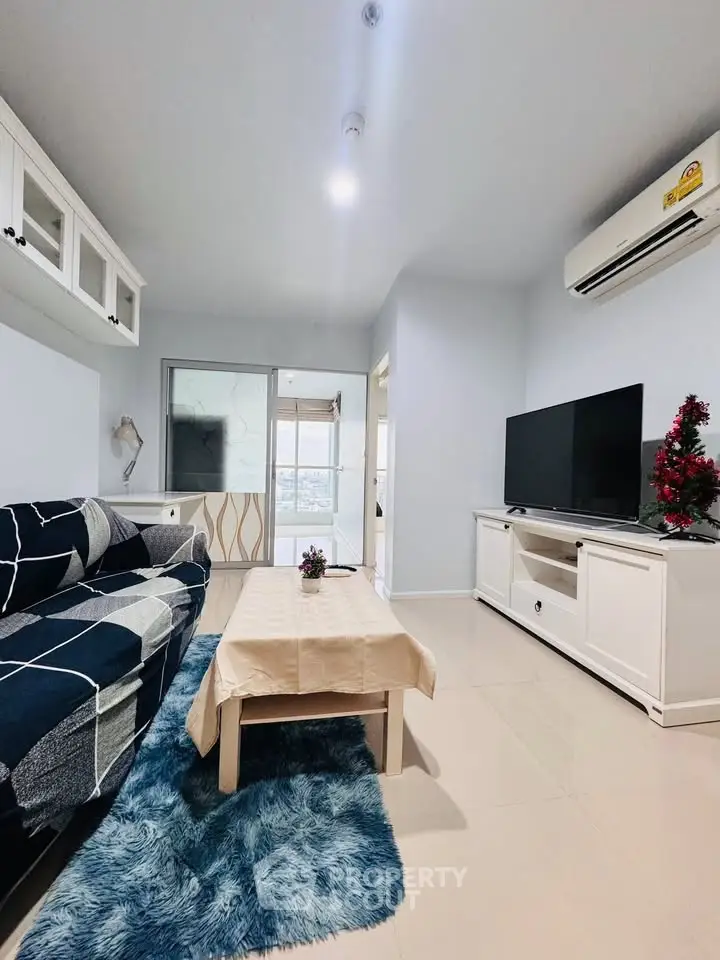 Modern living room with stylish decor, featuring a cozy sofa, sleek TV unit, and elegant lighting.