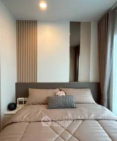 Modern bedroom with stylish decor and cozy bedding