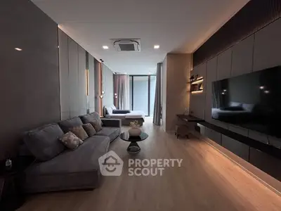 Luxurious modern living room with sleek design and spacious layout, featuring elegant furniture and ambient lighting.