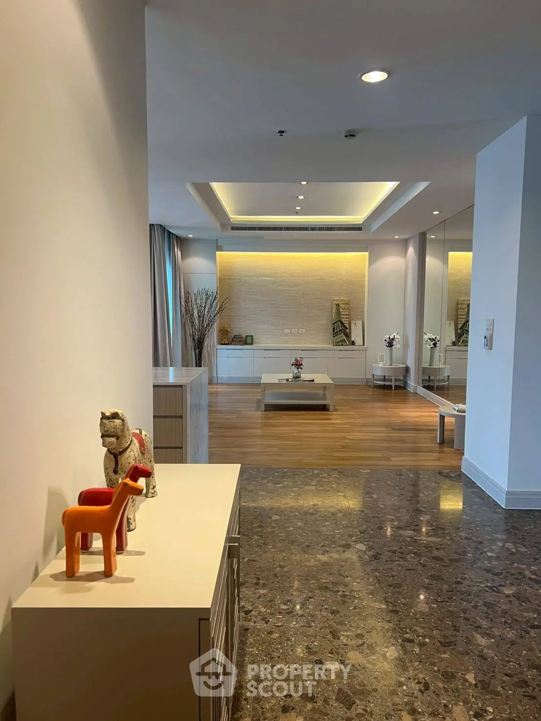 Spacious modern living room with elegant decor and marble flooring