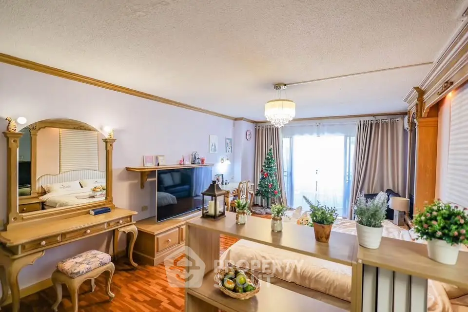 Spacious living room with elegant decor and large windows offering natural light.