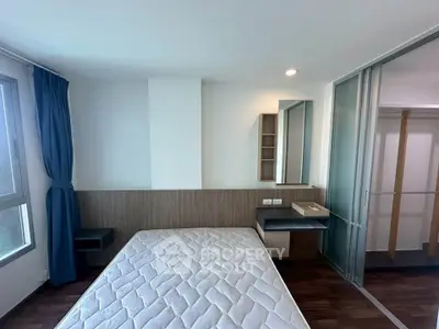 Modern bedroom with large window and minimalist design