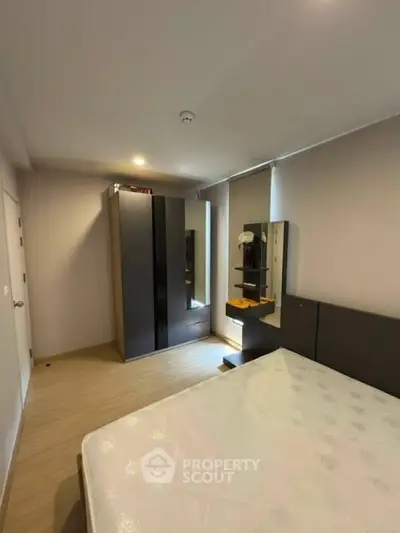 Modern bedroom with sleek wardrobe and stylish decor