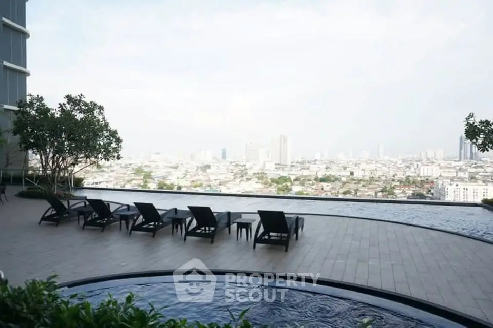 Luxurious rooftop infinity pool with stunning city skyline view
