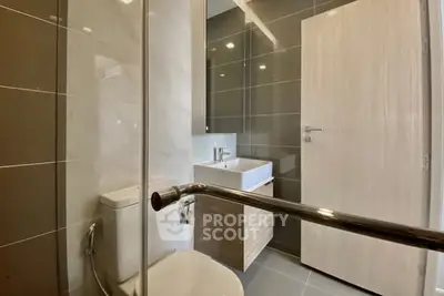 Modern bathroom with sleek fixtures and neutral tones