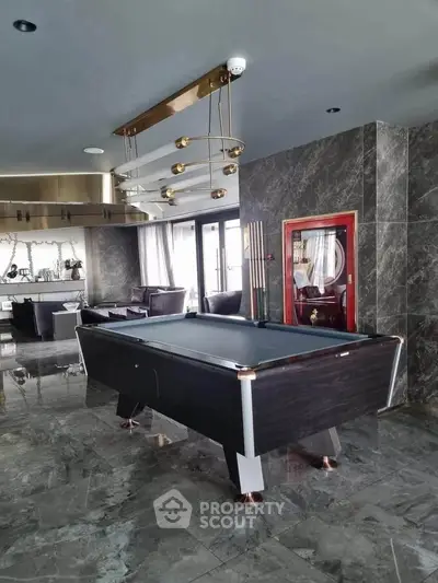Luxurious living room with pool table and modern decor in high-end apartment