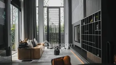 Luxurious modern living room with high ceilings and stylish decor