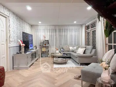 Elegant living room with modern decor and cozy seating area