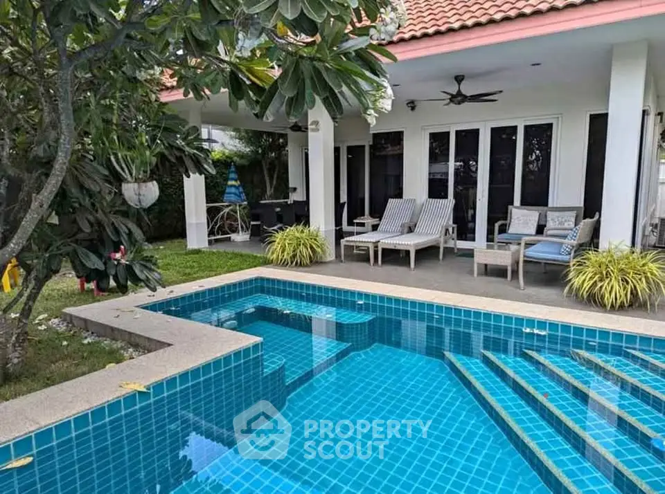 Luxurious villa with private pool and lush garden, perfect for relaxation and entertaining.