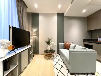 Modern living room with sleek decor and open kitchen layout