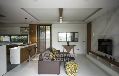 Modern open-plan living room with stylish kitchen and elegant decor