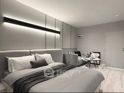 Modern bedroom with sleek design and cozy ambiance, featuring a stylish bed and contemporary decor.