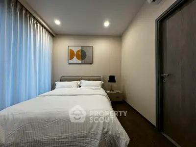 Cozy modern bedroom with elegant decor and soft lighting