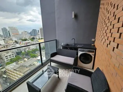 Stylish balcony with city view, outdoor seating, and washing machine.