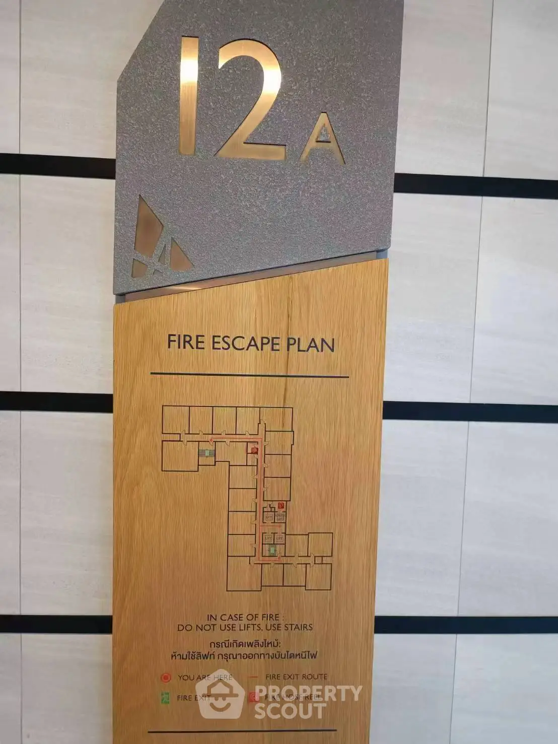 Modern fire escape plan signage on 12th floor of a contemporary building