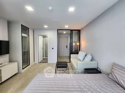 Modern studio apartment with sleek design and cozy furnishings