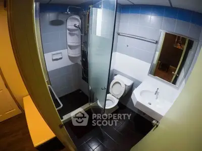 Modern bathroom with glass shower and sleek fixtures