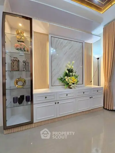 Elegant living room with modern decor and stylish cabinetry