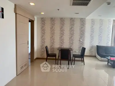 Spacious living room with elegant wallpaper and modern furniture