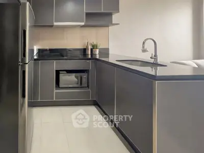 Modern kitchen with sleek cabinetry and built-in appliances, perfect for contemporary living.