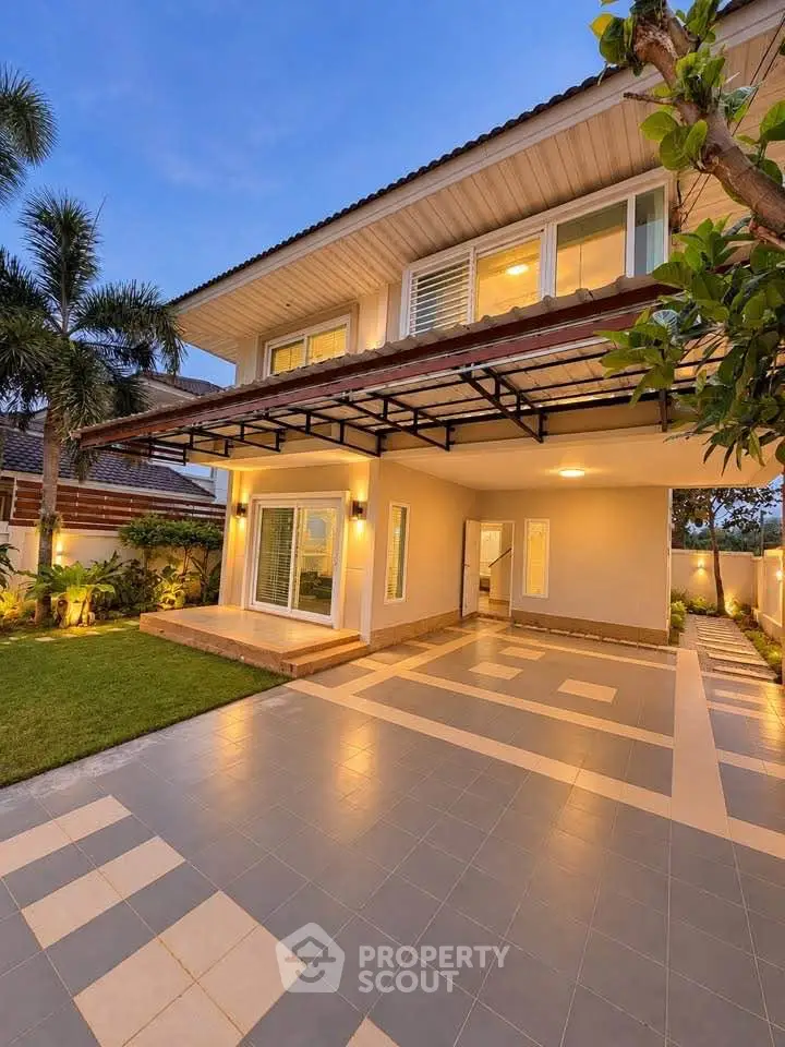 Stunning modern two-story house with spacious driveway and lush garden, perfect for family living.