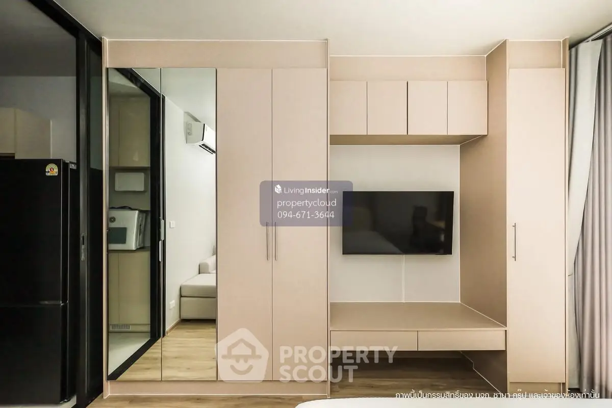 Modern living room with built-in storage and TV, sleek design