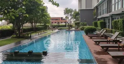 Luxurious residential pool area with modern design and lush greenery