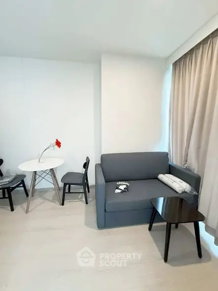 Modern living room with sleek gray sofa and minimalist decor