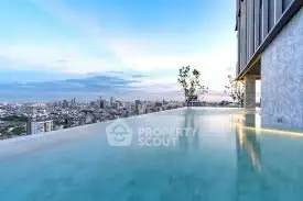 Luxurious rooftop infinity pool with stunning city skyline view
