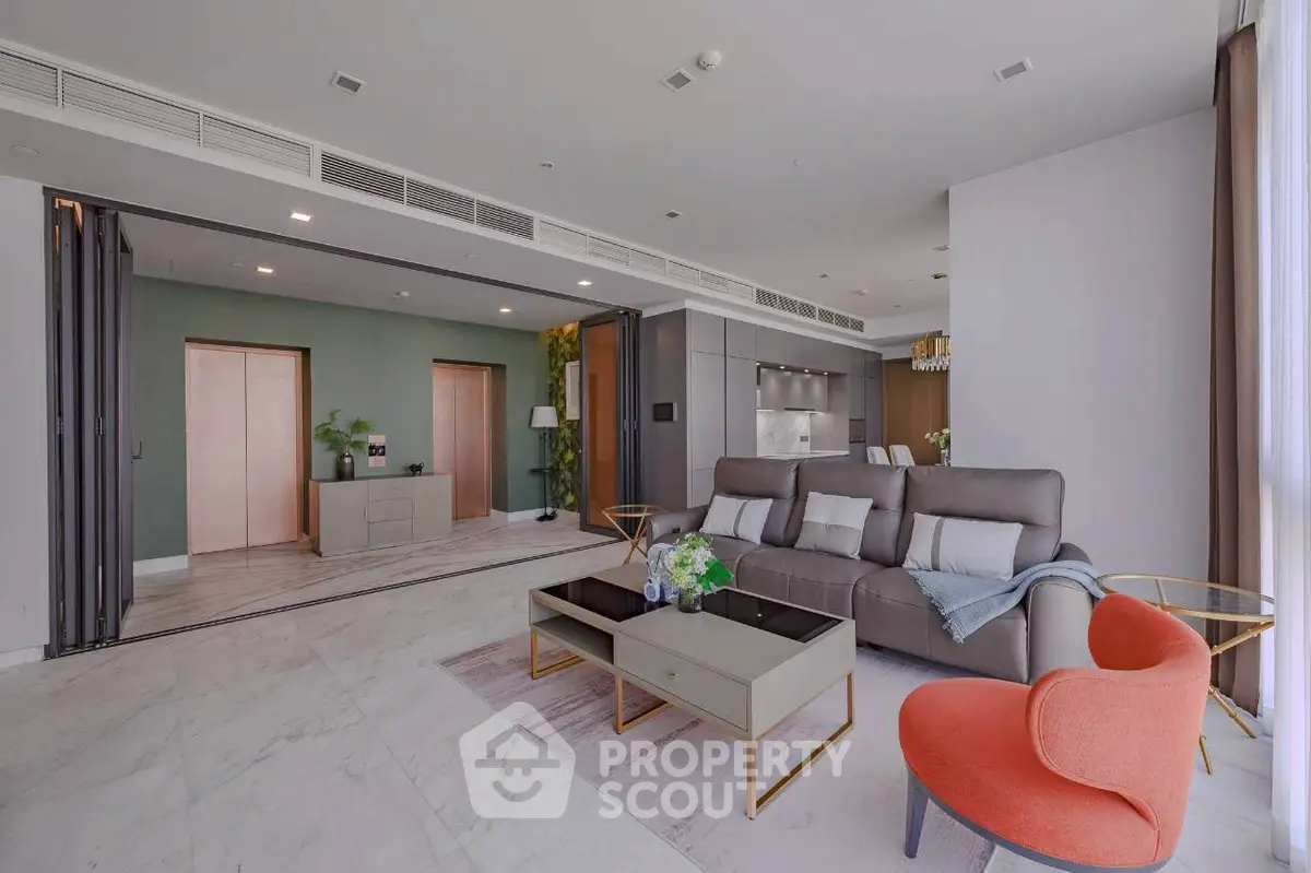 Spacious modern living room with elegant furniture and open kitchen layout, perfect for luxury living.