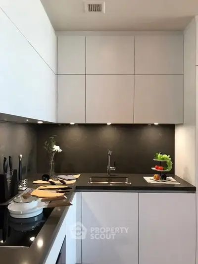 Modern kitchen with sleek cabinetry and integrated appliances