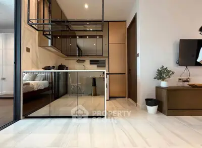 Modern open-plan living room with sleek kitchen and stylish decor