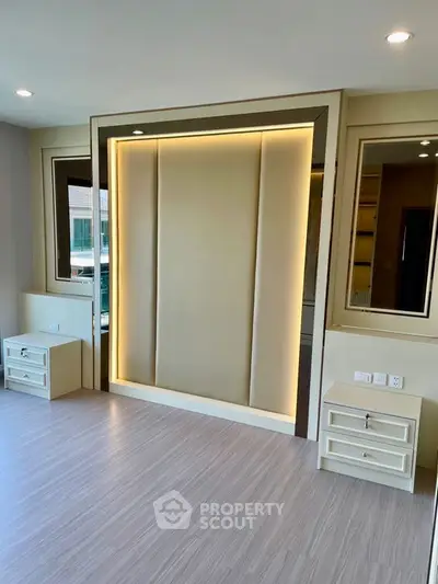 Modern bedroom with sleek design and built-in lighting