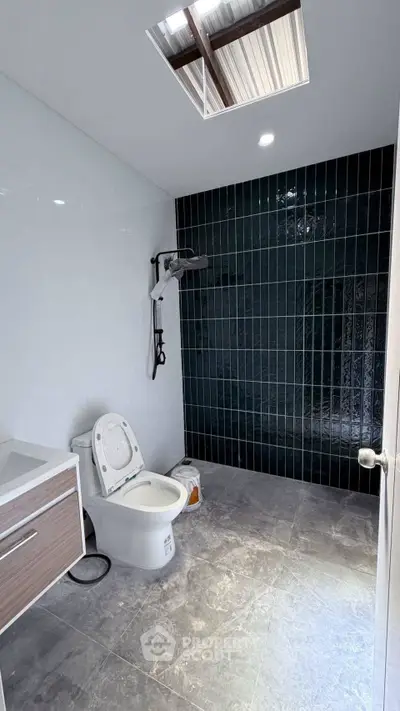 Modern bathroom with sleek black tiles and contemporary fixtures